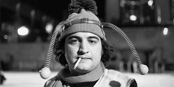 1975, Manhattan, New York, New York, USA --- Comedian John Belushi, in a bumble bee costume, skates at the Rockefeller Center Ice Rink for a skit on Saturday Night Live. --- Image by © Owen Franken/CORBIS